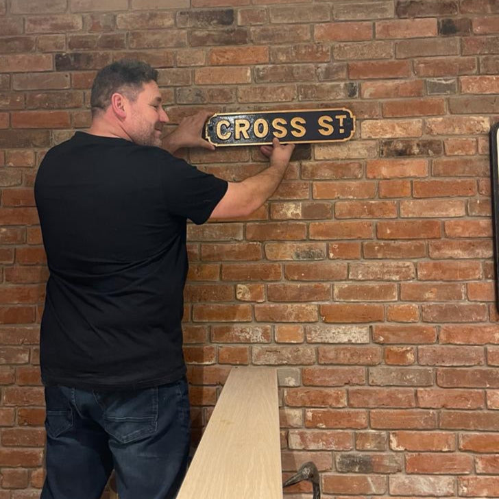 Reclaimed Handmade Bricks & Cast Iron Street Sign Feature Wall in Home