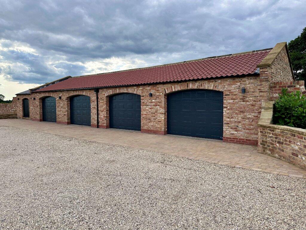 Modern Family Farmhouse Built Using Reclaimed Handmade Bricks