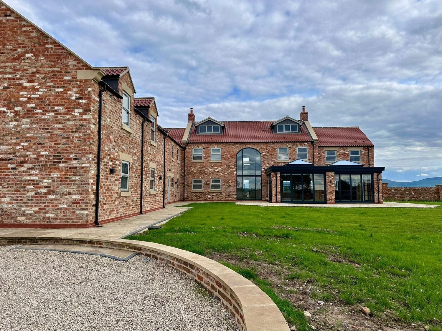 Modern Family Farmhouse Built Using Reclaimed Handmade Bricks