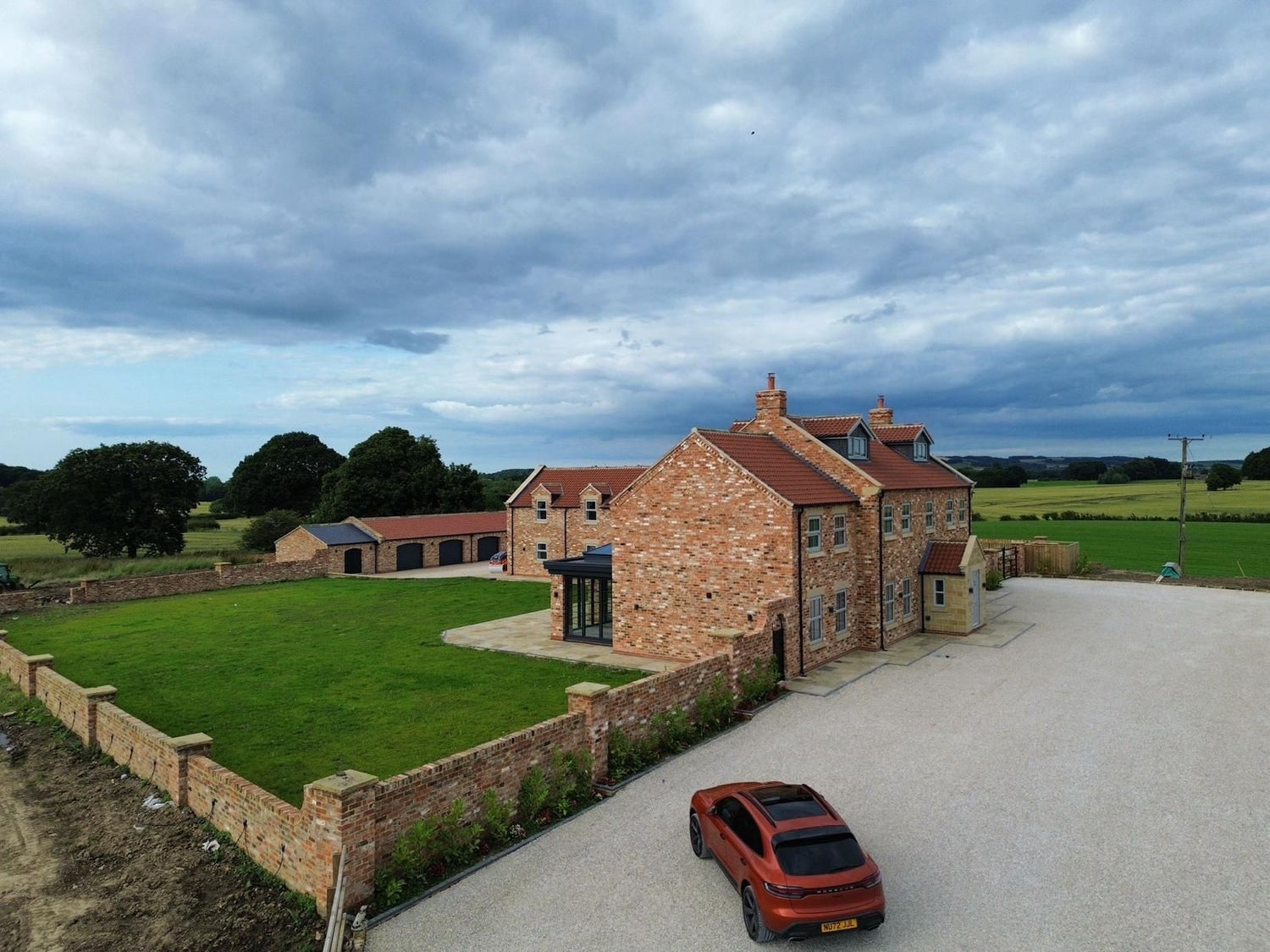 Modern Family Farmhouse Built Using Reclaimed Handmade Bricks