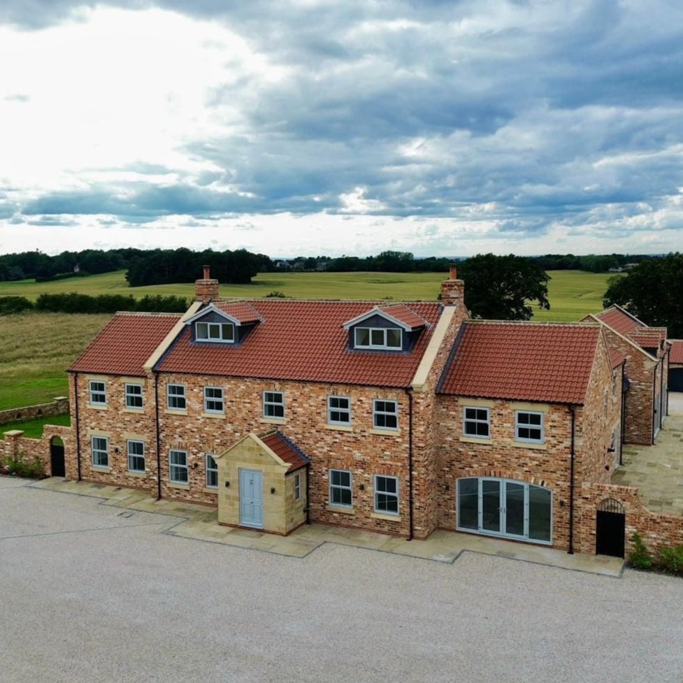 Modern Family Farmhouse Built Using Reclaimed Handmade Bricks