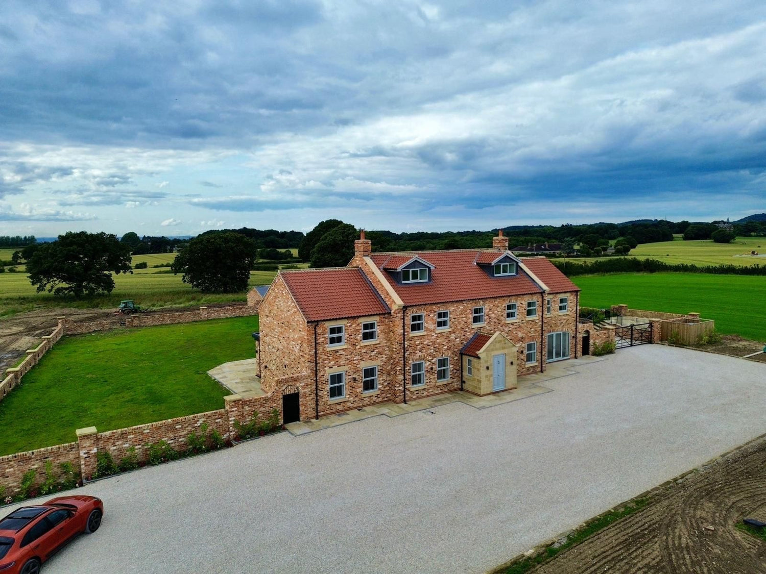 Modern Family Farmhouse Built Using Reclaimed Handmade Bricks