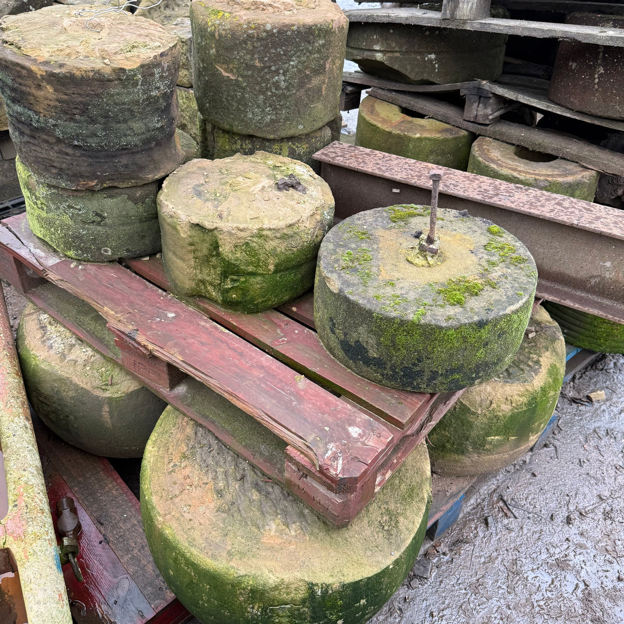 Reclaimed Mill Stone with Metal Bar