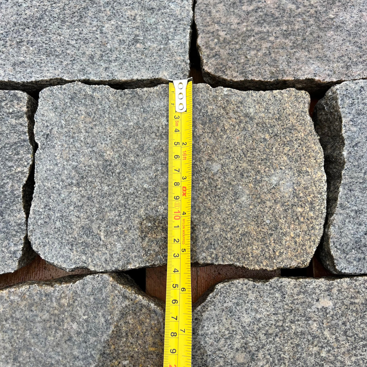 Reclaimed Smooth Granite Cobble Tops - Per SQM