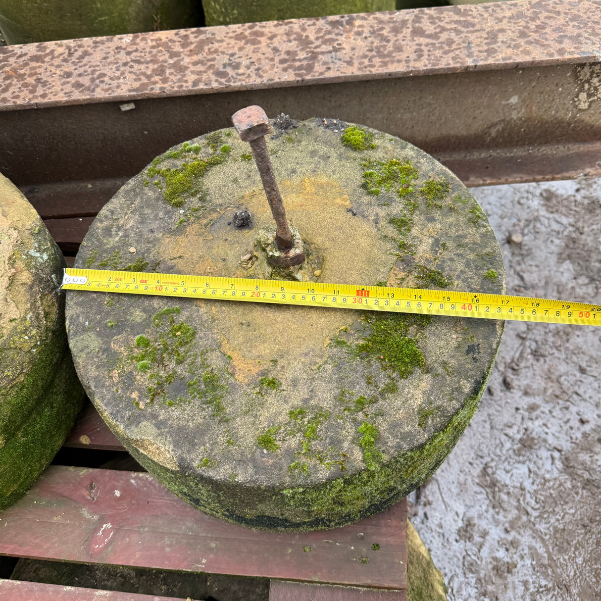 Reclaimed Mill Stone with Metal Bar