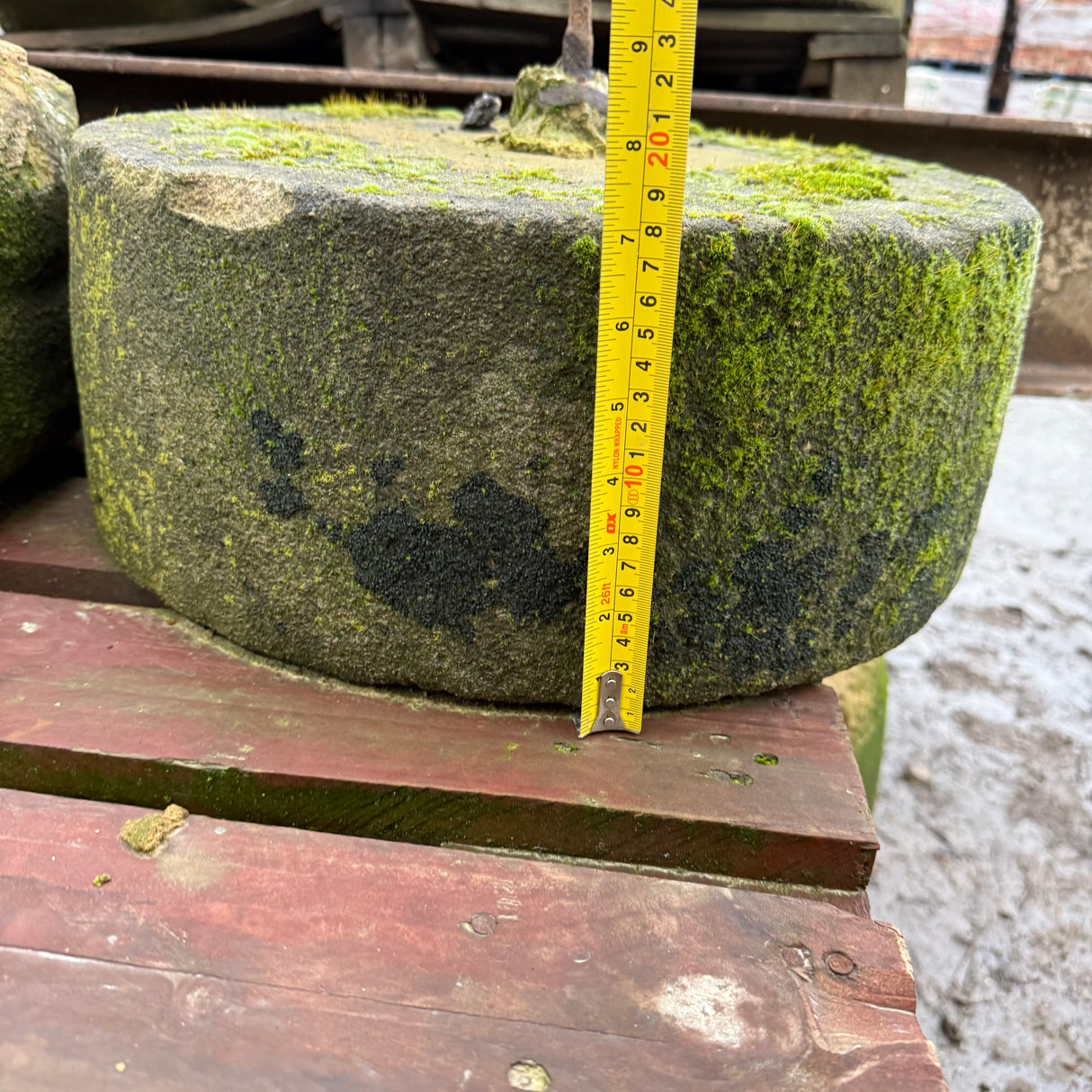 Reclaimed Mill Stone with Metal Bar