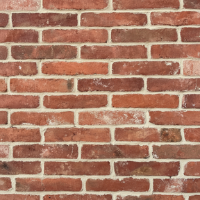 Pattern of red bricks with varying shades