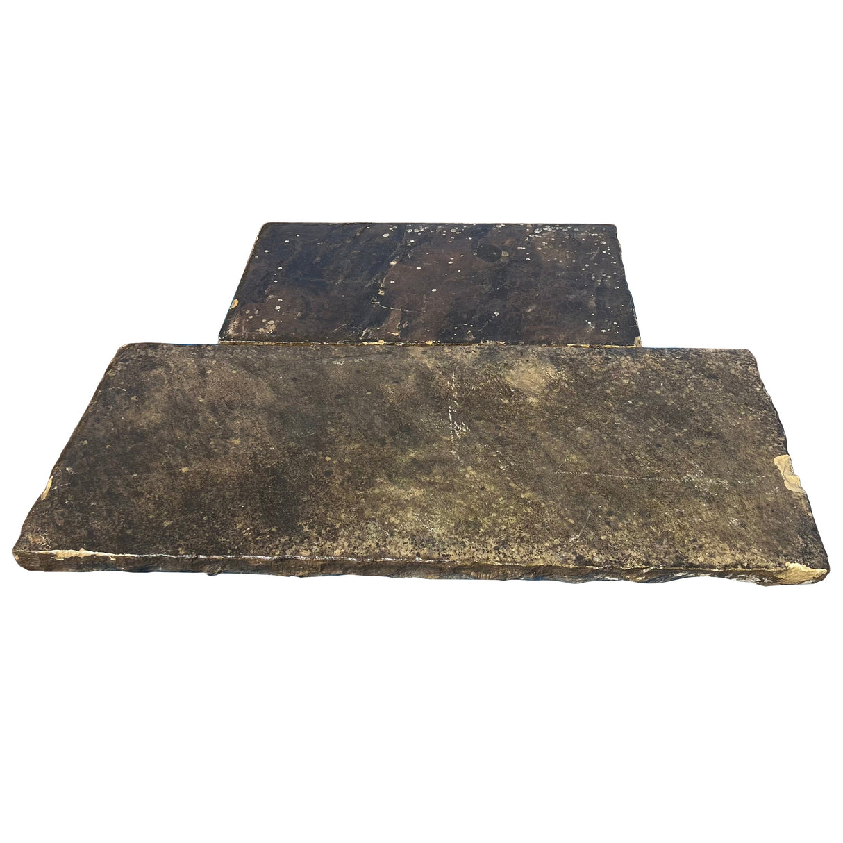 Two dark brown stone slabs on a white background