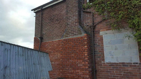 Brick slip cladding applied to chimney and side elevation during installation