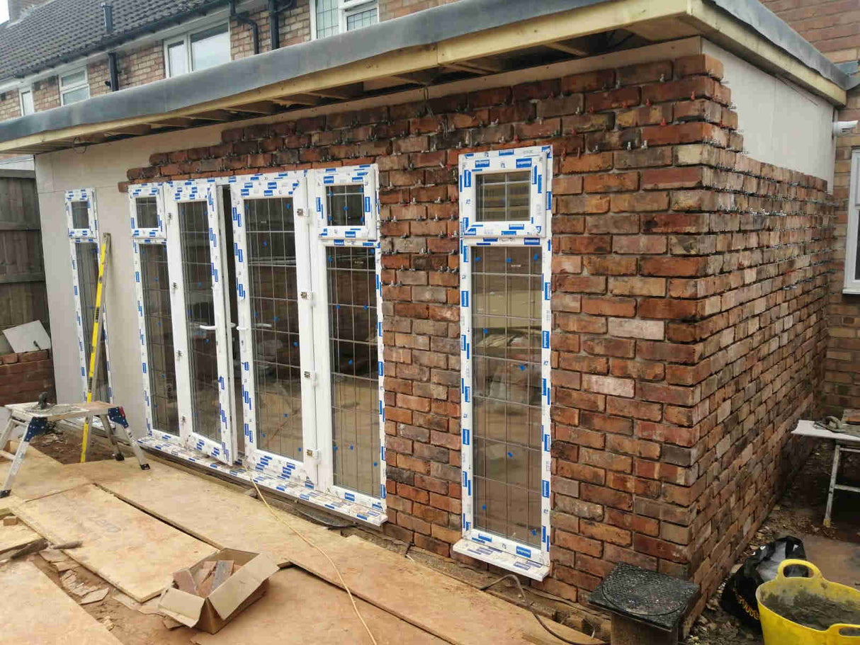 Reclaimed brick slips during project