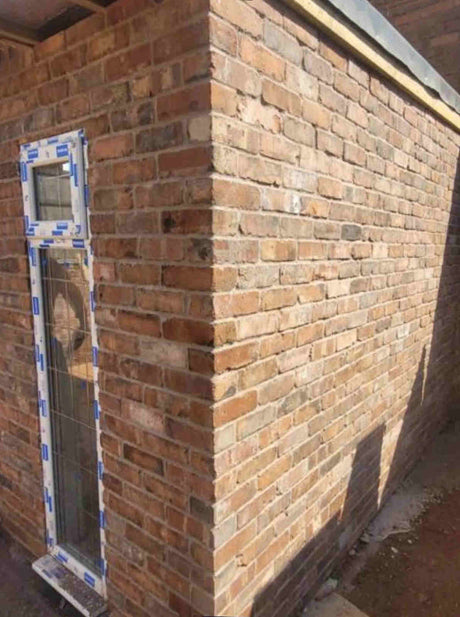 Reclaimed brick slips project corner side view
