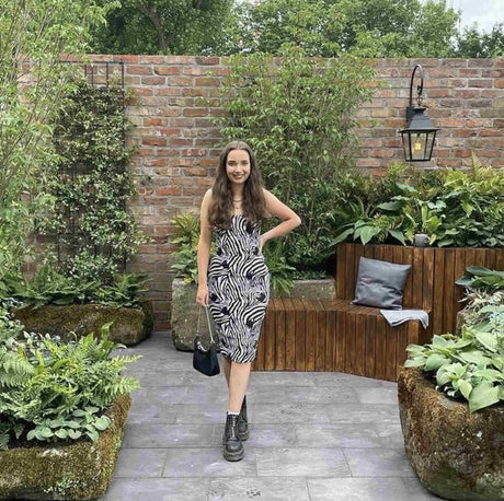 Visitor standing beside brick slip garden wall at RHS Chelsea Flower Show