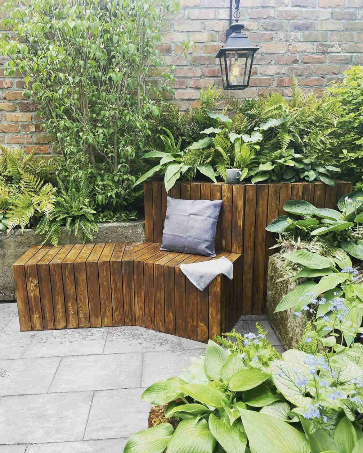 Reclaimed brick slip garden wall close up image in garden