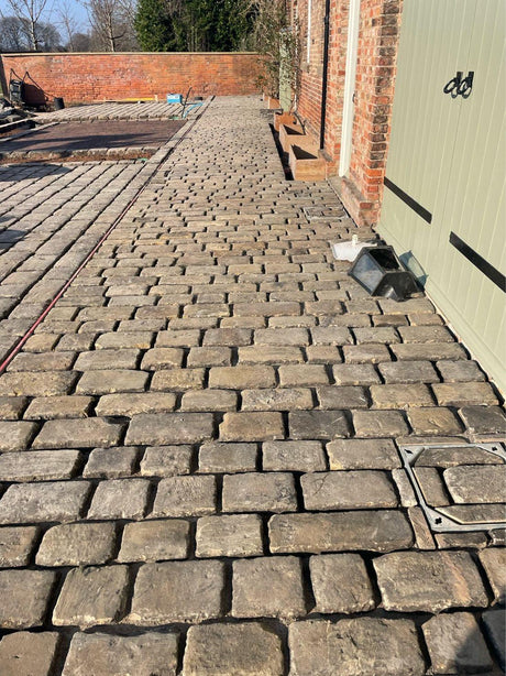 Court Yard using Reclaimed Gritstone Cobbles, Bristol - Reclaimed Brick Company