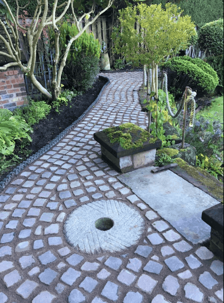 Granite Cobble Pathway with Stone Grinding Wheel Feature - Reclaimed Brick Company