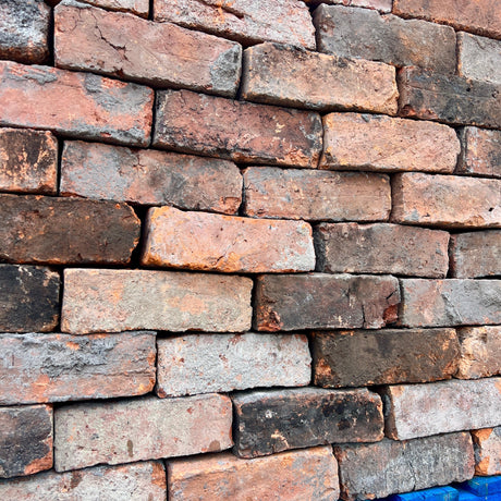 Close-up of Reclaimed 3 inch Victorian Handmade Imperial Bricks showing weathered texture - Reclaimed Brick Company