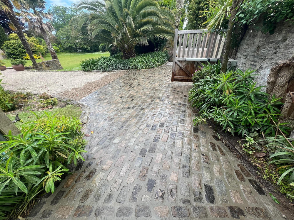 Completed driveway entrance laid with reclaimed granite setts in Cornwall